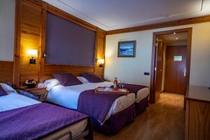 Ένα ή περισσότερα κρεβάτια σε δωμάτιο στο Hotel Nordic
