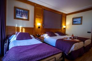 Ένα ή περισσότερα κρεβάτια σε δωμάτιο στο Hotel Nordic