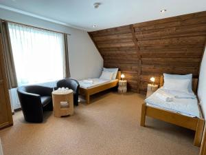 Postel nebo postele na pokoji v ubytování Hotel Kristian