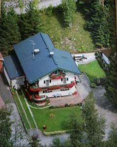 an aerial view of a house with a blue roof at Sand 4 in Stanzach