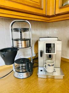 a kitchen counter with a coffee maker and a toaster at Ferienhaus Annu in Lensahn