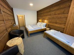 Postel nebo postele na pokoji v ubytování Hotel Kristian