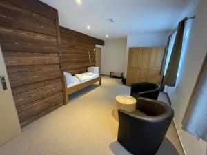 Postel nebo postele na pokoji v ubytování Hotel Kristian