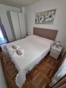 Postel nebo postele na pokoji v ubytování Apartments Ledic