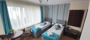 Postel nebo postele na pokoji v ubytování Villa Magna