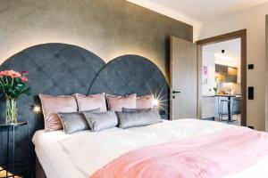 Ένα ή περισσότερα κρεβάτια σε δωμάτιο στο La Rosea - Fine Living Apartments +31 φωτογραφίες