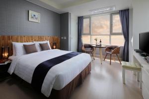 Postel nebo postele na pokoji v ubytování Ever8 Serviced Residence