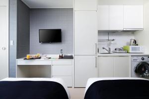 Kuchyň nebo kuchyňský kout v ubytování Ever8 Serviced Residence
