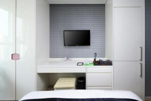 TV a/nebo společenská místnost v ubytování Ever8 Serviced Residence
