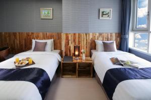 Postel nebo postele na pokoji v ubytování Ever8 Serviced Residence