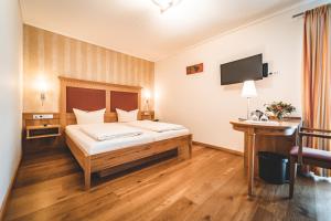 Postel nebo postele na pokoji v ubytování Hotel & Gasthof Löwen