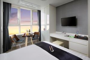 Postel nebo postele na pokoji v ubytování Ever8 Serviced Residence