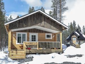 a small log cabin in the snow at Holiday Home Poromies b by Interhome in Saariselka