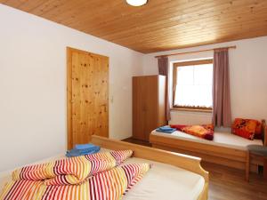 Postel nebo postele na pokoji v ubytování Apartment Zillertalblick by Interhome