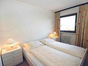 Cama o camas de una habitación en Apartment Excelsior by Interhome