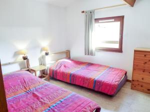 a bedroom with two beds and a window at Holiday Home Les As-9 by Interhome in Lacanau-Océan