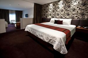 Tempat tidur dalam kamar di The Gateway Inn, Newcastle