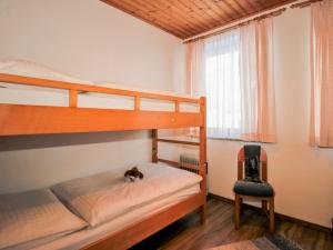 Postel nebo postele na pokoji v ubytování Apartment Edelweiss-1 by Interhome