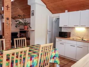 a kitchen and dining room with a table and chairs at Apartment Ennstalblick by Interhome in Weyern