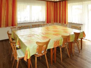 a dining room with a table and chairs at Apartment Elisabeth - ZAZ778 by Interhome in Aschau