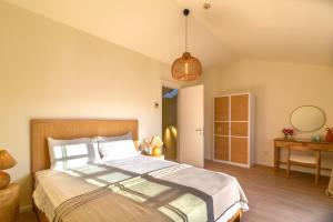 Postel nebo postele na pokoji v ubytování Portvillas by Villa Safiya