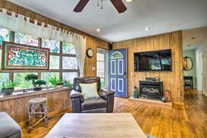 a living room with a couch and a fireplace at Charming Hampton Bays Home 5 Mi to Coopers Beach in Hampton Bays