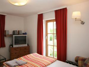 A bed or beds in a room at Holiday Home kleine Winten by Interhome