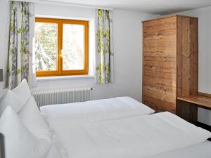 A bed or beds in a room at Holiday Home Schönblick - KPL643 by Interhome