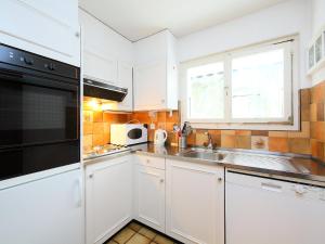 Η κουζίνα ή μικρή κουζίνα στο Apartment Regina C1