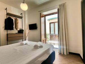 Ένα ή περισσότερα κρεβάτια σε δωμάτιο στο Ponticello Apartments