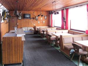 A restaurant or other place to eat at Holiday Home Mittagspitze - TCH200 by Interhome