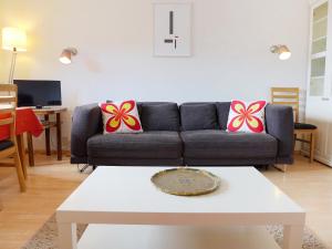 a living room with a couch and a coffee table at Apartment Farinet B 21 by Interhome in Crans-Montana