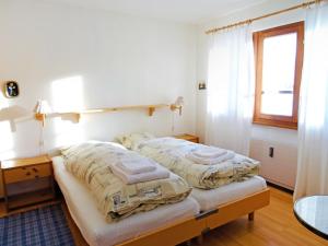 Ένα ή περισσότερα κρεβάτια σε δωμάτιο στο Apartment Aragon F130 by Interhome