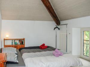 a bedroom with a bed and a book shelf at Apartment Tazzino by Interhome in Locarno +15 photos