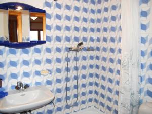 a bathroom with a sink and a shower at Apartment Beausoleil H by Interhome in Veysonnaz