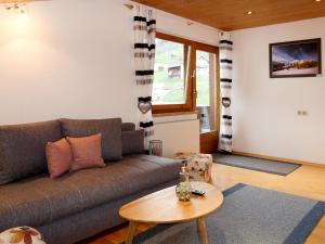 a living room with a couch and a table at Apartment Susanne by Interhome in Kauns