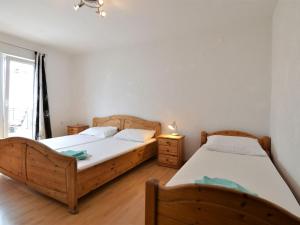 Postel nebo postele na pokoji v ubytování Apartment Josip-2 by Interhome
