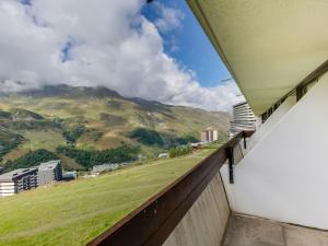a balcony with a view of a mountain at Apartment Brelin La Challe 635 by Interhome in Les Menuires