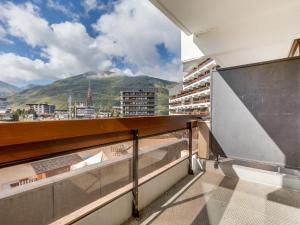 a balcony with a view of a mountain at Apartment Chavière-5 by Interhome in Les Menuires