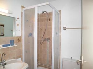 a bathroom with a shower with a toilet and a sink at Apartment Vistaéro by Interhome in Le Barcarès