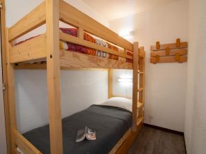 a bedroom with two bunk beds in a room at Apartment Le Borsat - Val Claret-10 by Interhome in Tignes +12 photos