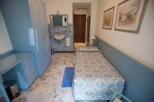 Кровать или кровати в номере Hotel Ariston