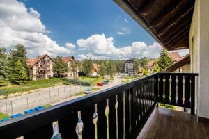 a balcony with a view of a street at Apartment Sunčana dolina in Zlatibor