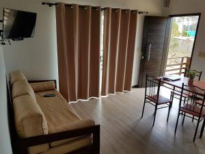 a living room with a couch and a table at Puertas De La Serena in La Paloma