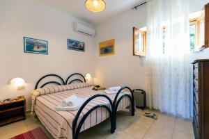 Postel nebo postele na pokoji v ubytování HibiscusUno Tropea Residence