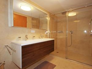 a bathroom with a sink and a shower at Apartment Living House Vandans by Interhome in Vandans