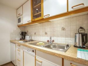 a kitchen with a sink and a counter top at Apartment Christian by Interhome in Pettneu am Arlberg