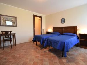 Holiday Home La Corte Bricca - Casa Padronale by Interhome tesisinde bir odada yatak veya yataklar