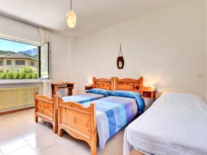 Ένα ή περισσότερα κρεβάτια σε δωμάτιο στο Apartment Agostini-3 by Interhome
