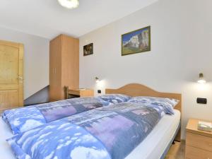 A bed or beds in a room at Apartment Cecilia-2 by Interhome